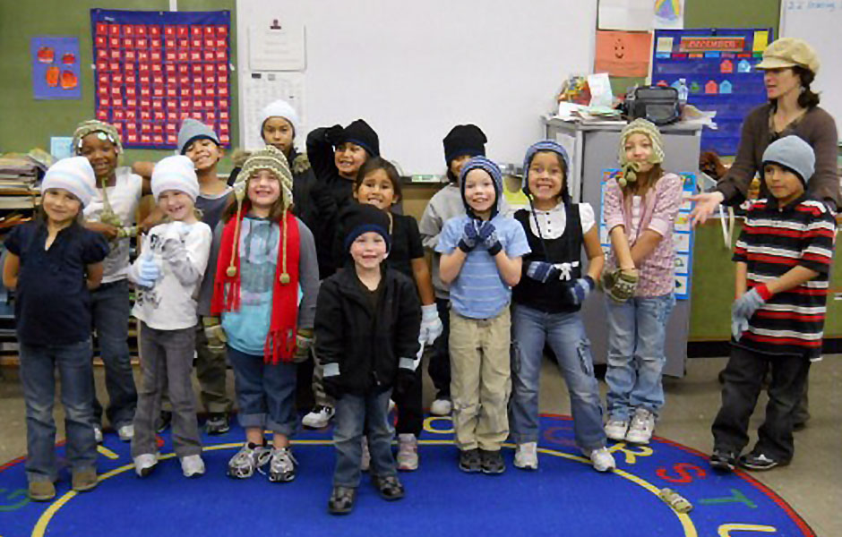 Children wearing hats in a classroom